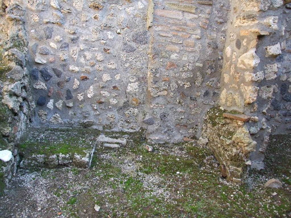 I.11.8.Kitchen with site of stairs to upper floor on left and site of latrine on right