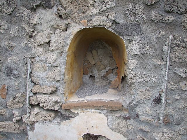 I.11.10 Pompeii. September 2005. Aedicula lararium on the east wall.

