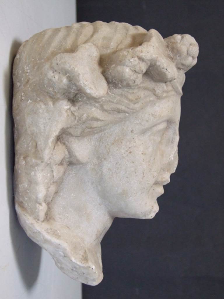 I.11.12 Pompeii. March 2009.  White marble Herm of Bacchante.  Found in a cavity in the South wall near the Aedicula Niche in 1958.  SAP inventory number: 12165.
