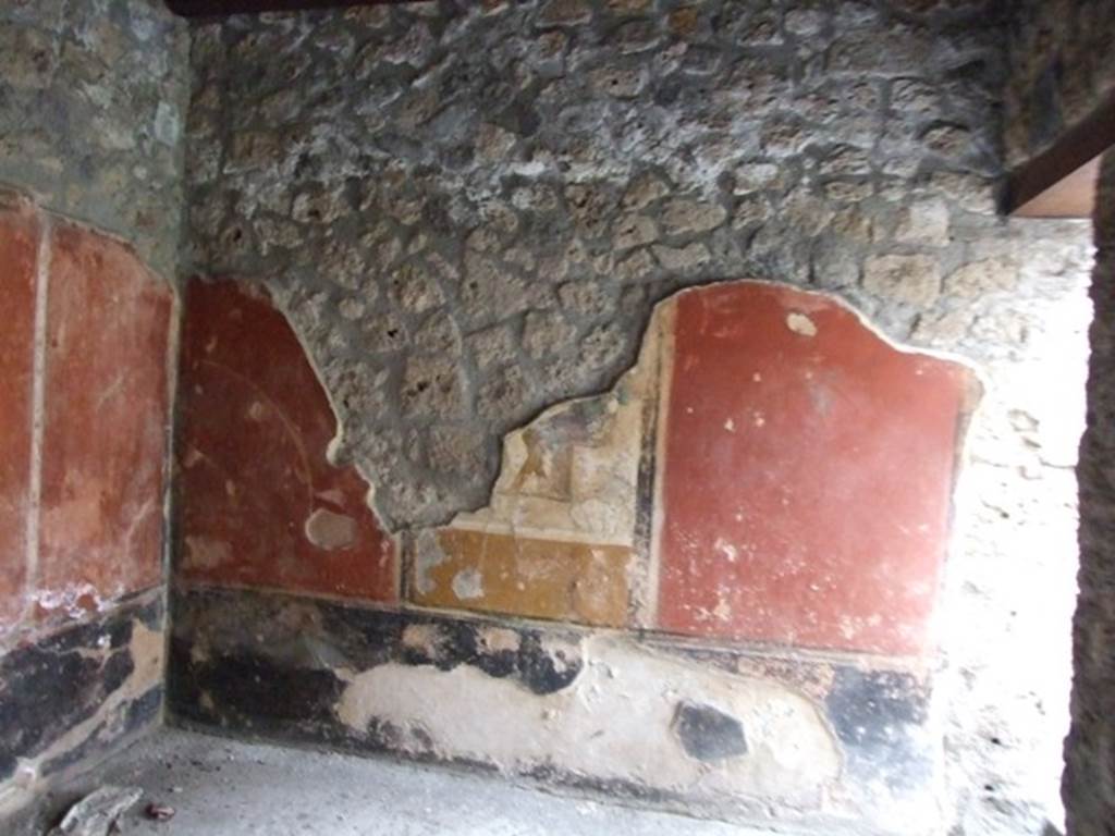 I.11.15 Pompeii.  December 2007.  Room 13.  Remains of wall painting with seated figure dressed in blue cloak.