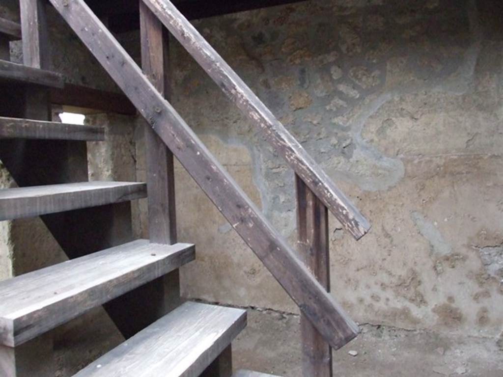 I.11.15 Pompeii.  December 2007.  Modern stairs to upper floor from area next to garden area.
