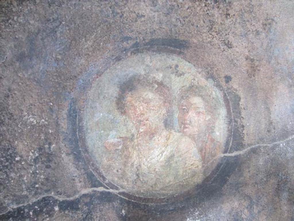 I.11.15 Pompeii. April 2012. Room 18, west end of north wall. Painted medallion portrait of woman and adolescent. Photo courtesy of Marina Fuxa.
