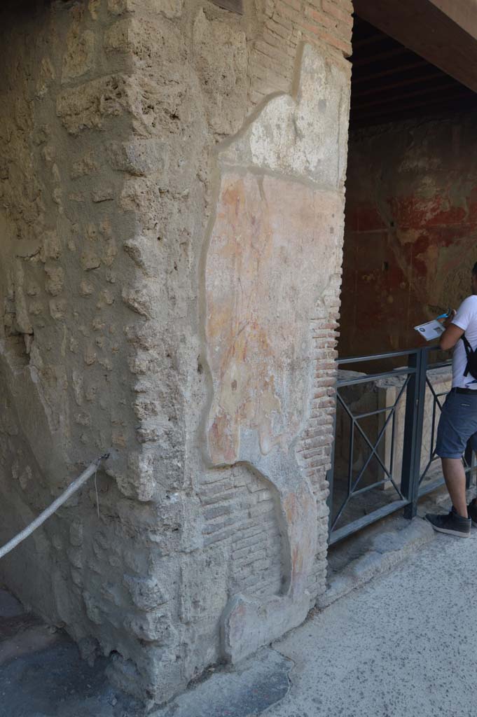 I.12.3 Pompeii. December 2018. 
Detail of remaining plaster on pilaster between doorways I.12.4 and I.12.3. Photo courtesy of Aude Durand.
