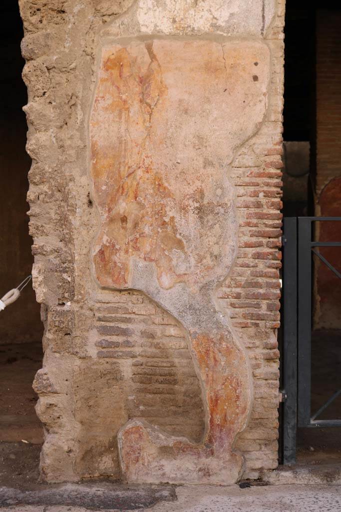 I.12.3 Pompeii.  December 2006.  Plaster on wall to east of door.