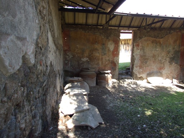 I.12.8 Pompeii. December 2018. 
Room 9, looking towards north wall with garden painting, on west side of doorway to room 13, rear garden. Photo courtesy of Aude Durand.
