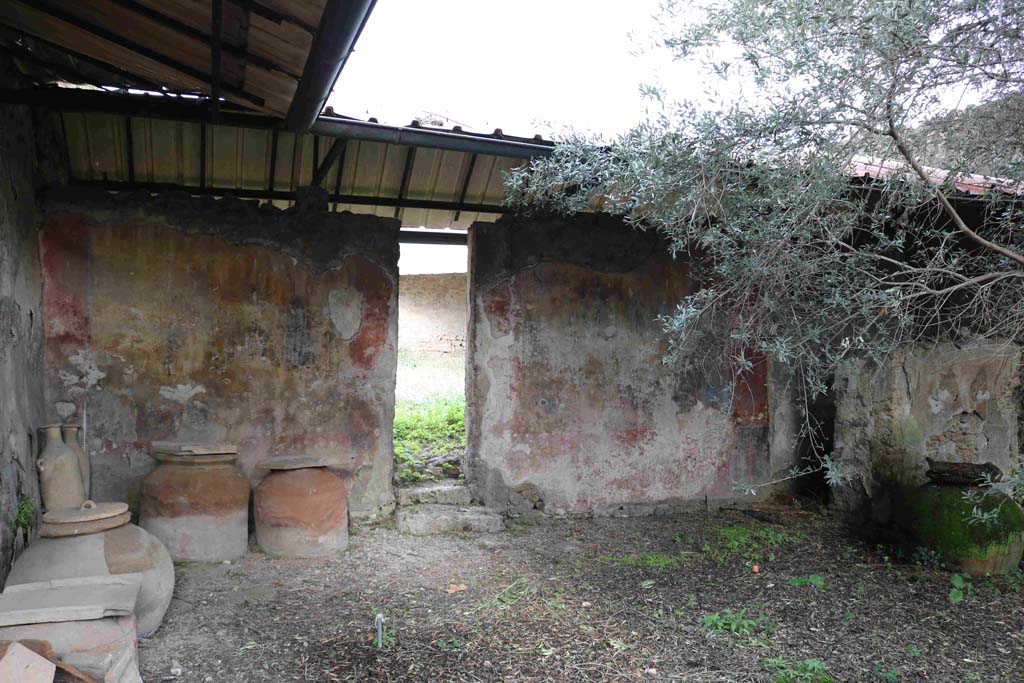 I.12.8 Pompeii. December 2018. 
Room 9, looking north towards dolia in north-west corner of peristyle garden. Photo courtesy of Aude Durand.
