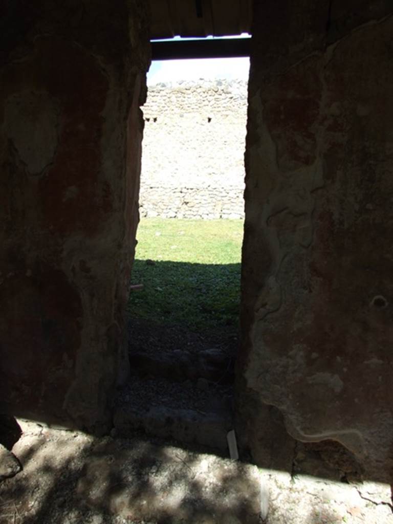 I.12.8 Pompeii.  March 2009.  Room 9.  Doorway with three steps in north wall to rear garden.