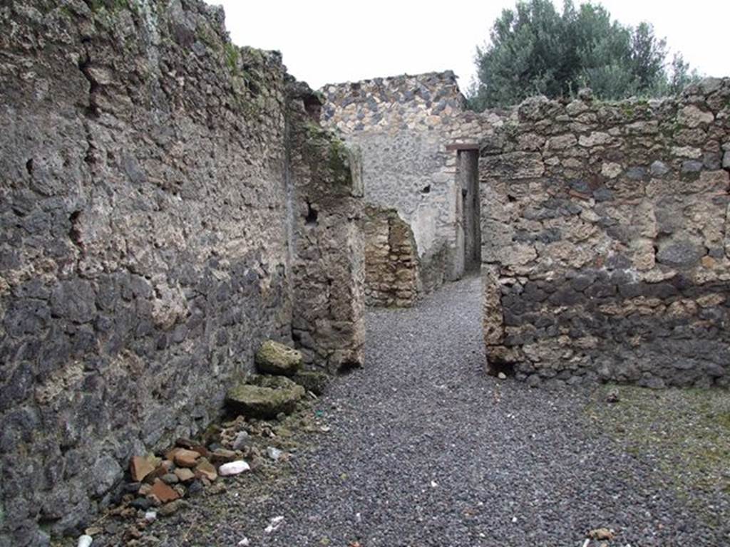 I.12.8 Pompeii. December 2006. Looking north from room 1, through doorway in north wall into room 5.

