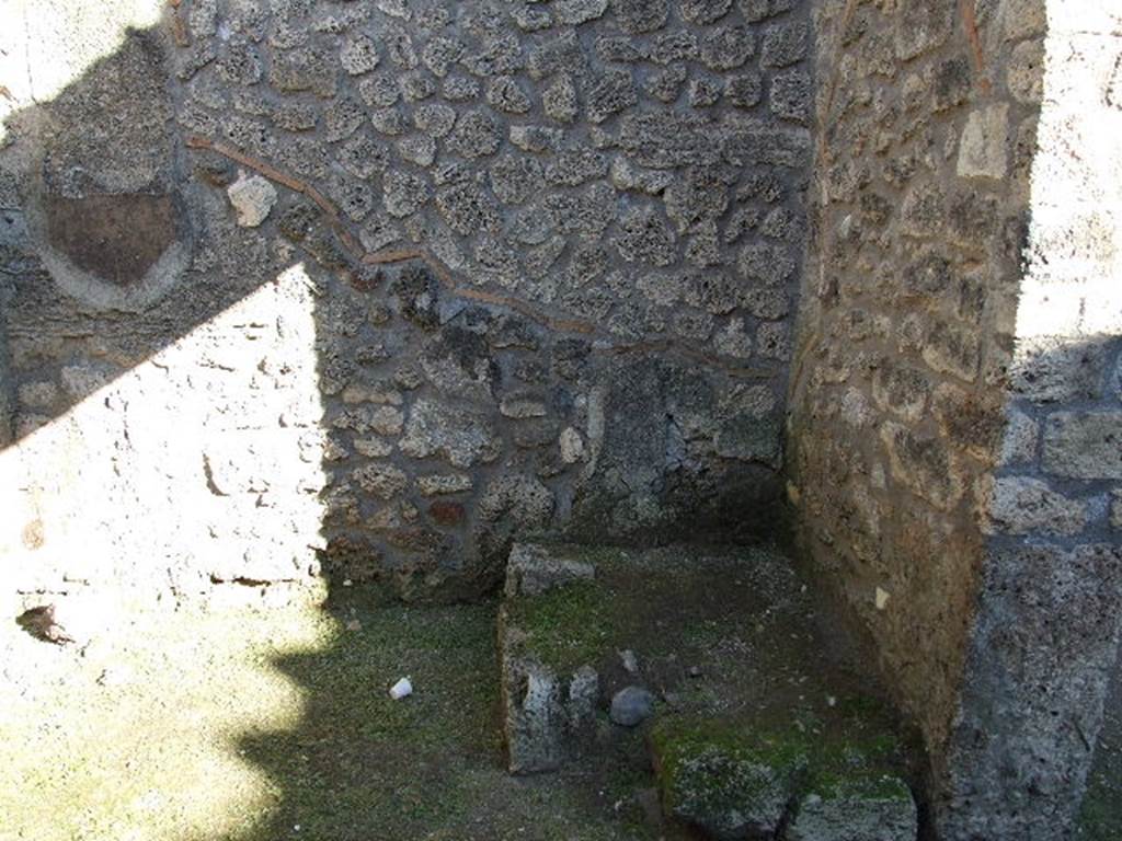 I.12.10 Pompeii. December 2006. South-east corner of shop, with base of stairs to upper floor.