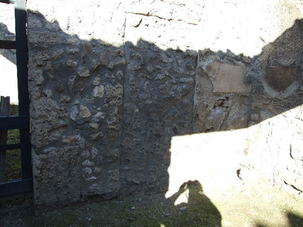 I.12.10 Pompeii. December 2006. North wall with blocked doorway.