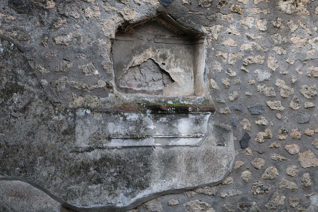 I.12.12 Pompeii. December 2018. Detail of niche of lararium in west wall. Photo courtesy of Aude Durand.