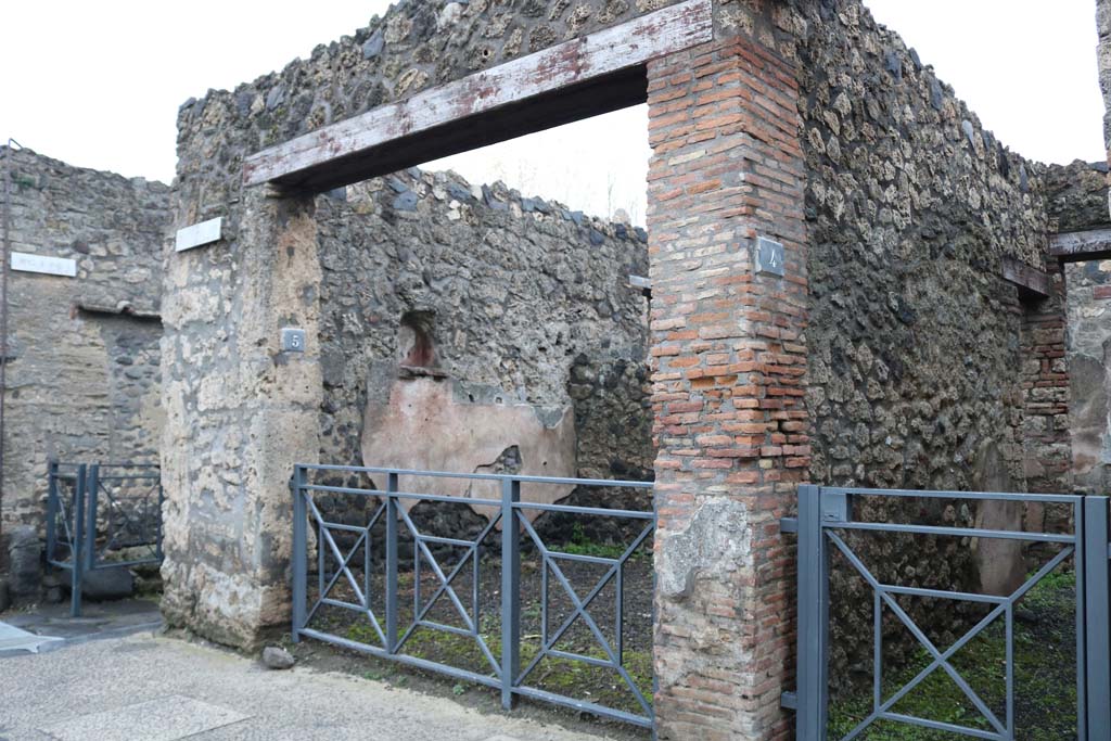 I.13.5 Pompeii, on left, with I.13.4, on right. December 2018. 
Looking south-east to entrance doorways. Photo courtesy of Aude Durand.
