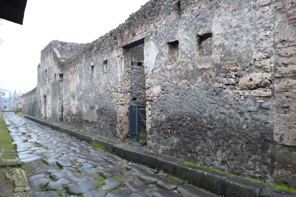 I.13.7 Pompeii. December 2018. 
Looking south along west side of Via di Nocera, towards entrance doorway, in centre. Photo courtesy of Aude Durand.
