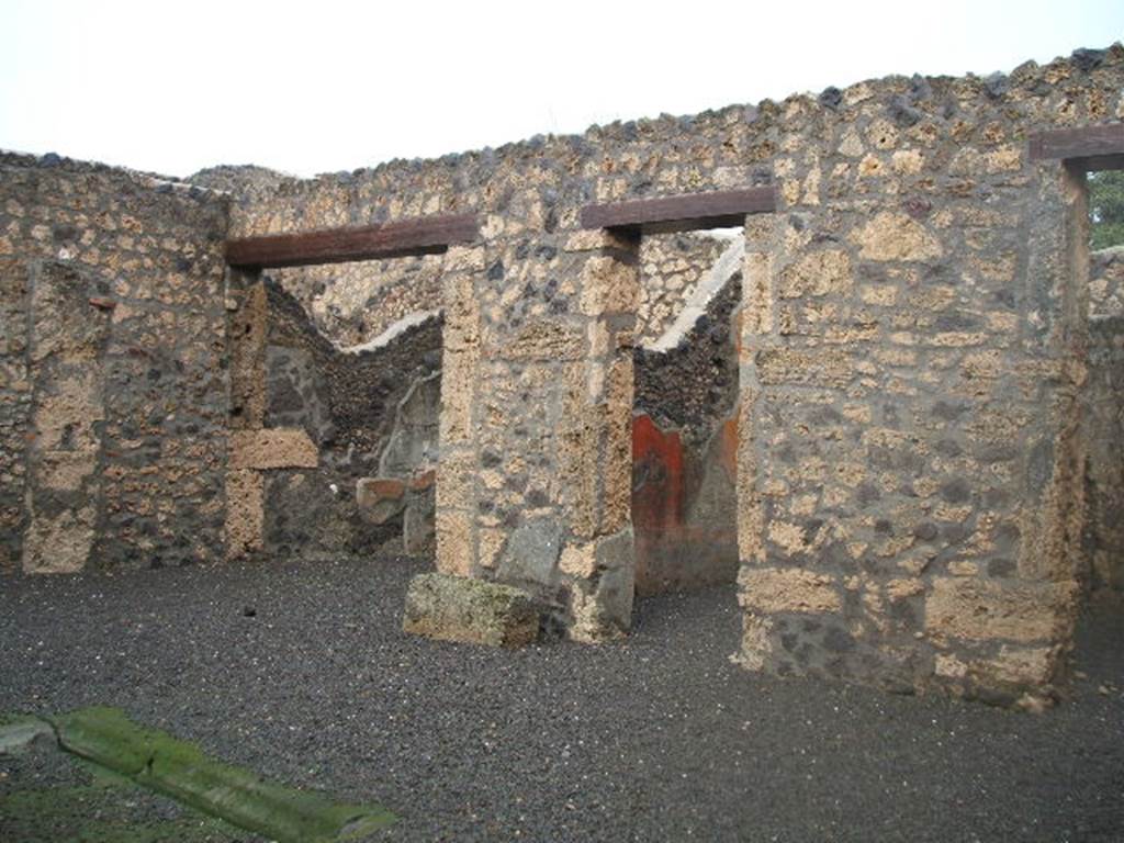 I.13.12 Pompeii. December 2004. East side of atrium, two doorways to Cubicula and an Ala.