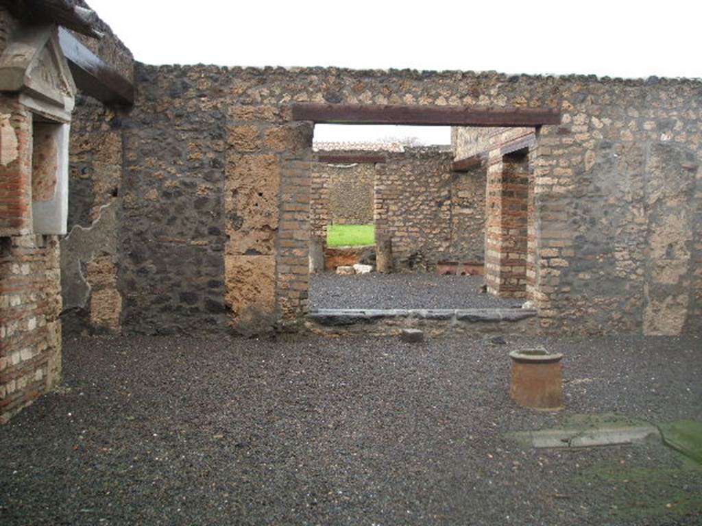 I.13.12 Pompeii. December 2004.  Looking north across Atrium without Tablinum, with doorway to small garden or yard.