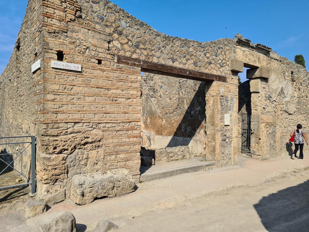 I.13.13, Pompeii, and I.13.12, on right. December 2018. 
Looking towards entrance doorways on north side of Via di Castricio. Photo courtesy of Aude Durand.


