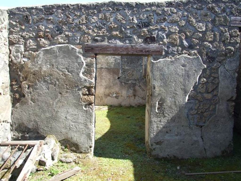 I.13.15 Pompeii. March 2009.  Doorway in east wall of central courtyard, at north end.