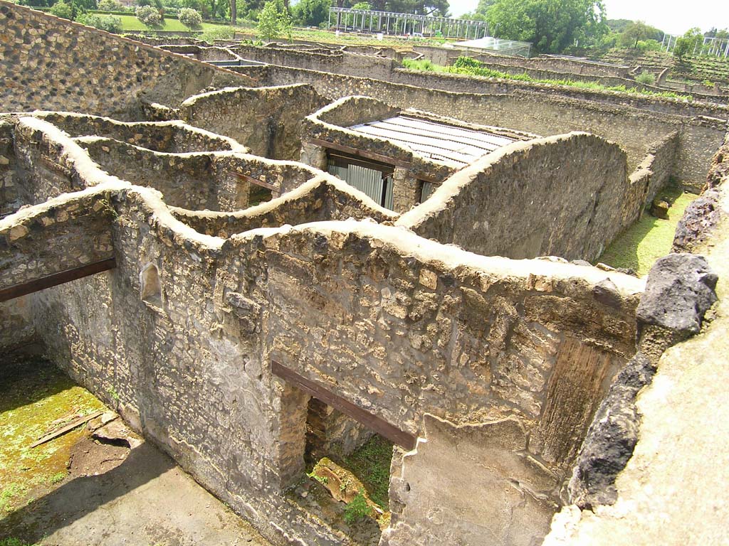 I.14.2 Pompeii. July 2008. Window to Garden M, lower centre, and tops of walls of rooms belonging to I.14.1, at rear.
Photo courtesy of Guilhem Chapelin. 
