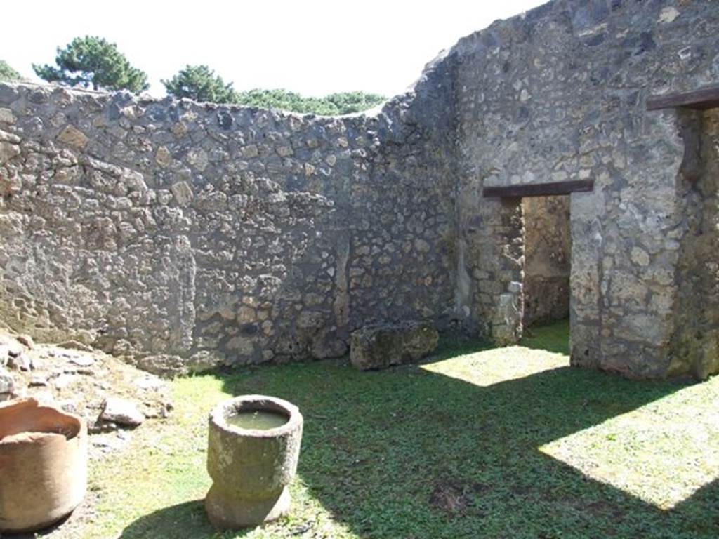 I.14.7 Pompeii.  March 2009. South east corner of atrium, with door to Cubiculum and corridor to rear.