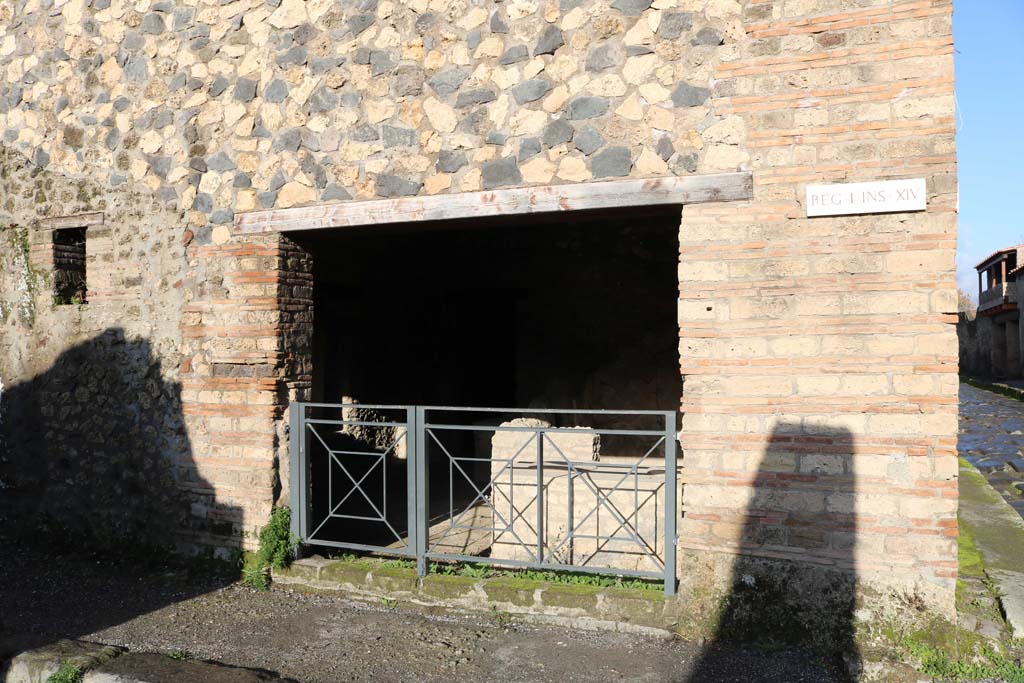 I.14.15 Pompeii. December 2018. 
Looking north towards entrance doorway at corner/junction with Via di Nocera, on right. Photo courtesy of Aude Durand.


