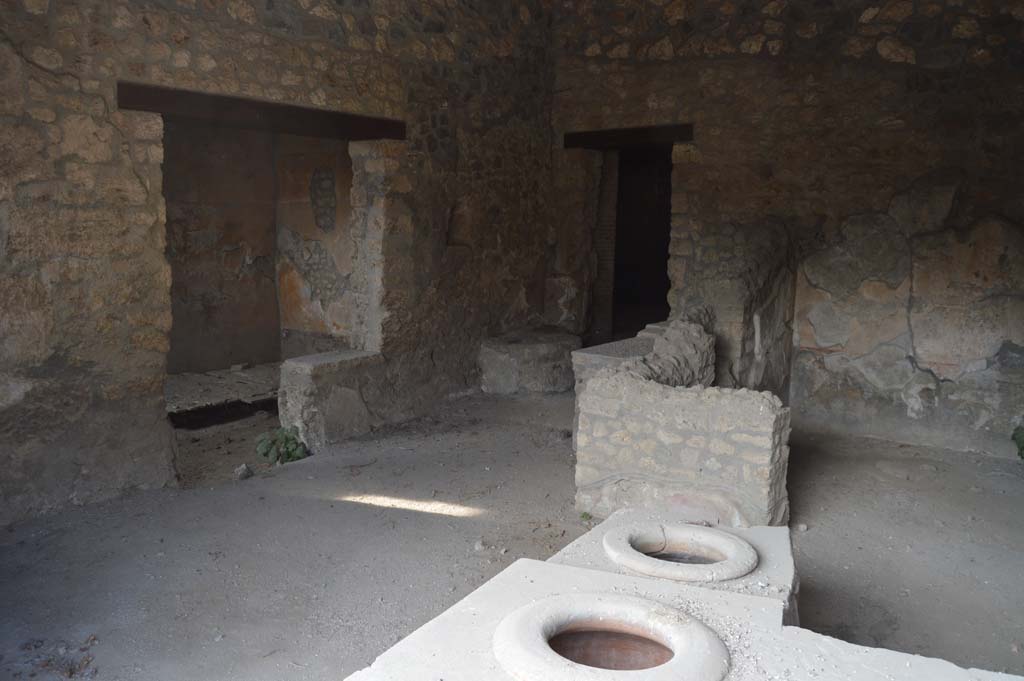 I.14.15 Pompeii. December 2018. 
West side of bar, with doorways to rooms on west and north side. Photo courtesy of Aude Durand.

