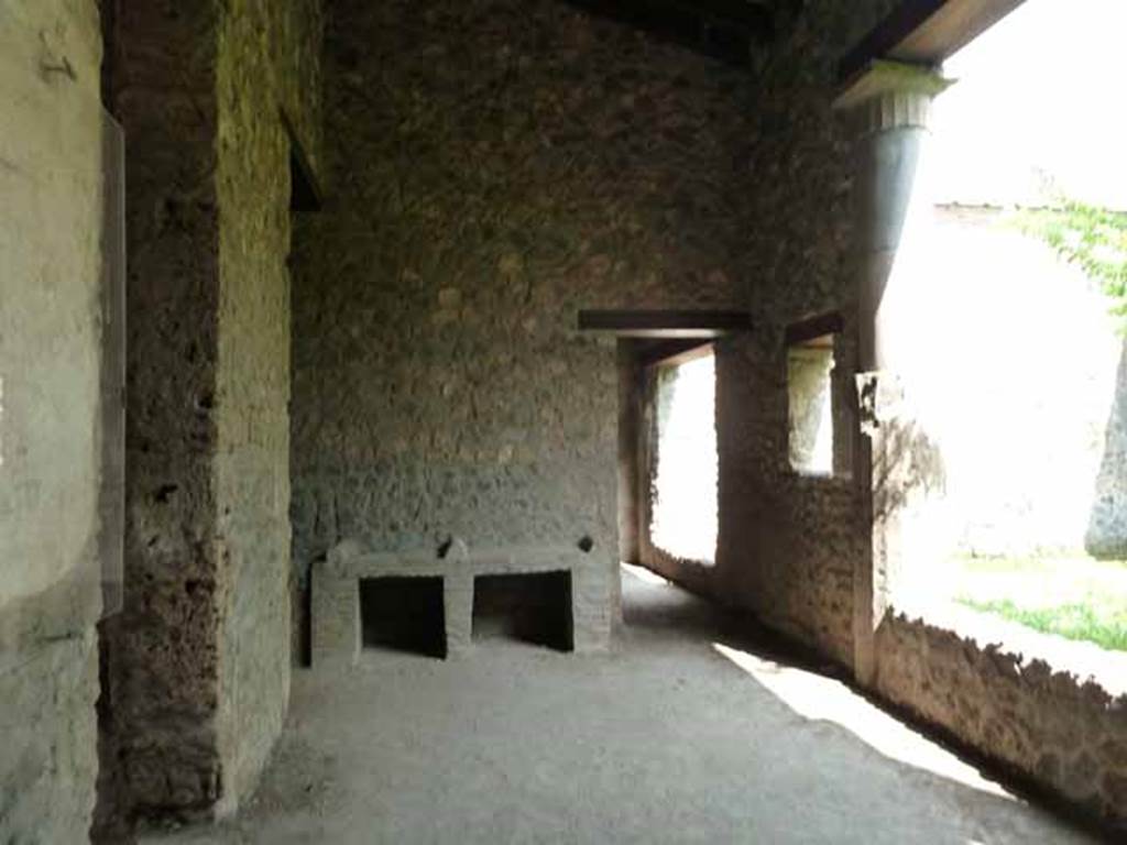 I.15.3 Pompeii. May 2010. 
Looking east along north portico 10 of peristyle 13. The doorway on the left leads to room 3 and entrance I.15.2.
