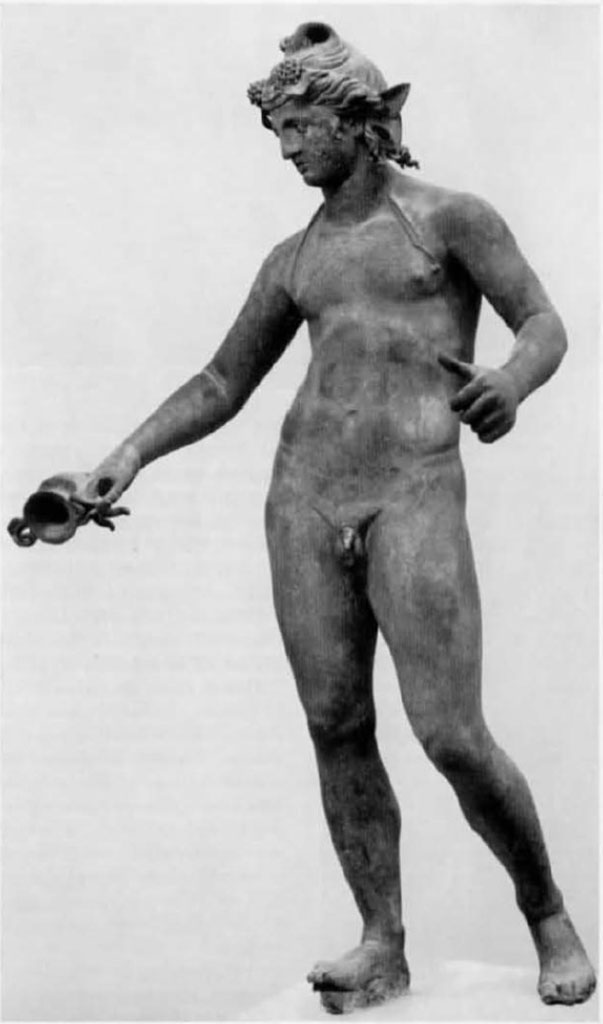 I.16.2 Pompeii. 1971. Bronze statue of Bacchus. SAP 11864.  Found 26th September 1957.  Photo by Stanley A. Jashemski.
Source: The Wilhelmina and Stanley A. Jashemski archive in the University of Maryland Library, Special Collections (See collection page) and made available under the Creative Commons Attribution-Non Commercial License v.4. See Licence and use details.
J71f0158

