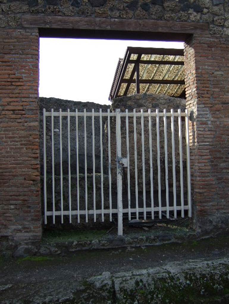I.20.2 Pompeii. December 2006. Looking south to counter, and doorway to I.20.1 in south wall.