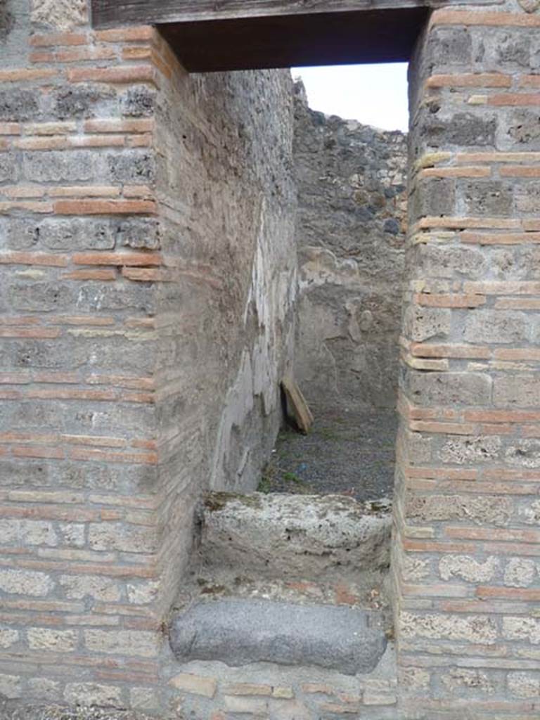 I.21.2 Pompeii. September 2015. Looking north through blocked doorway, east side.

 
