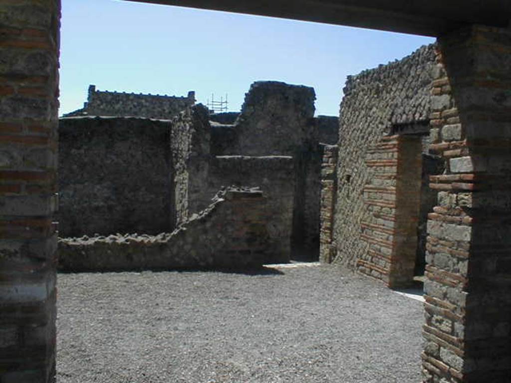 II.1.4 Pompeii.   May 2006. Rear room looking west towards II.1.3.