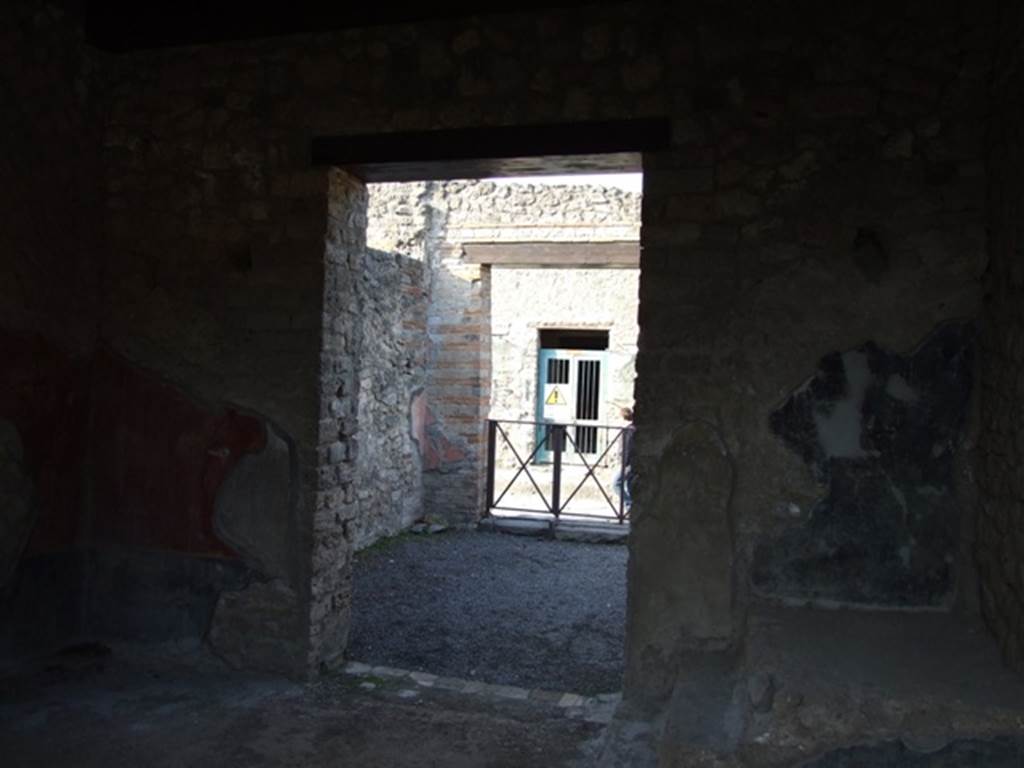 II.1.5 Pompeii.  Large Taberna.  Looking north through doorway of rear room towards entrance on Via dell' Abbondanza.