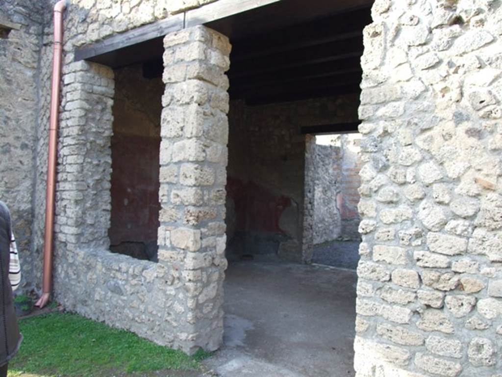 II.1.5 Pompeii.  Large Taberna.  Looking north through doorway of rear room from the garden.