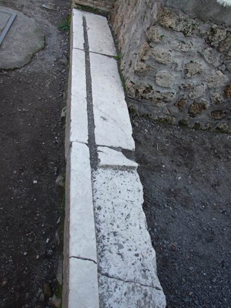 II.1.6 Pompeii. December 2007. Marble entrance sill with groove for doors or shutters
