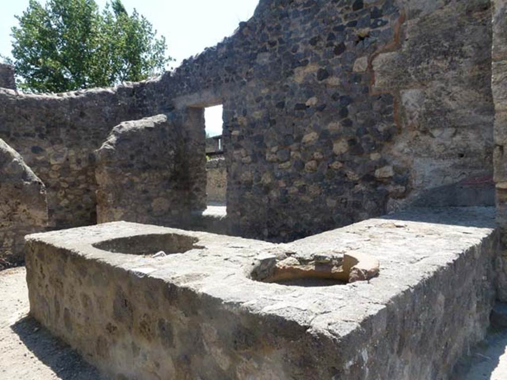 II.2.1 Pompeii. June 2012. Looking towards west wall with side doorway at II.1.6, leading to Vicolo di Octavius Quarto.  Photo courtesy of Michael Binns.
