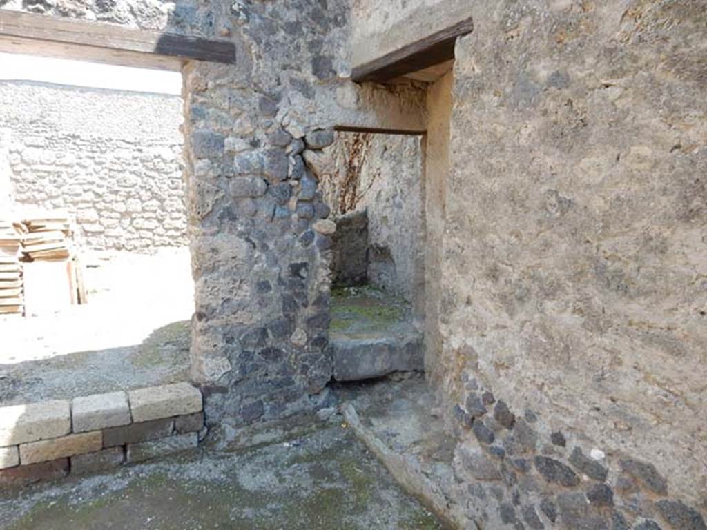 II.2.2 Pompeii. May 2016. Room 7, left, with small doorway to latrine 6, right.
Photo courtesy of Buzz Ferebee.

 
