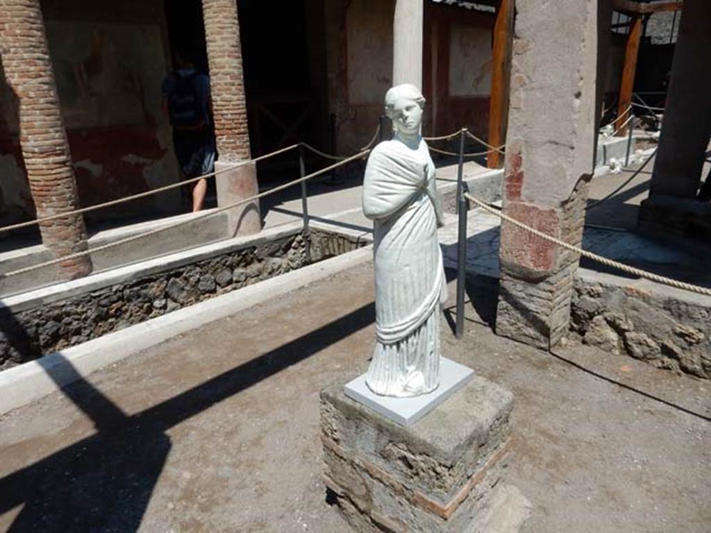 II.2.2 Pompeii. May 2016. 
Room “i”, looking north-east across upper euripus towards doorway to “myths” room and north wall of upper euripus.
Replaced statue of the muse Erato or Mnemosyne . SAP inventory number 2909.
Photo courtesy of Buzz Ferebee.
