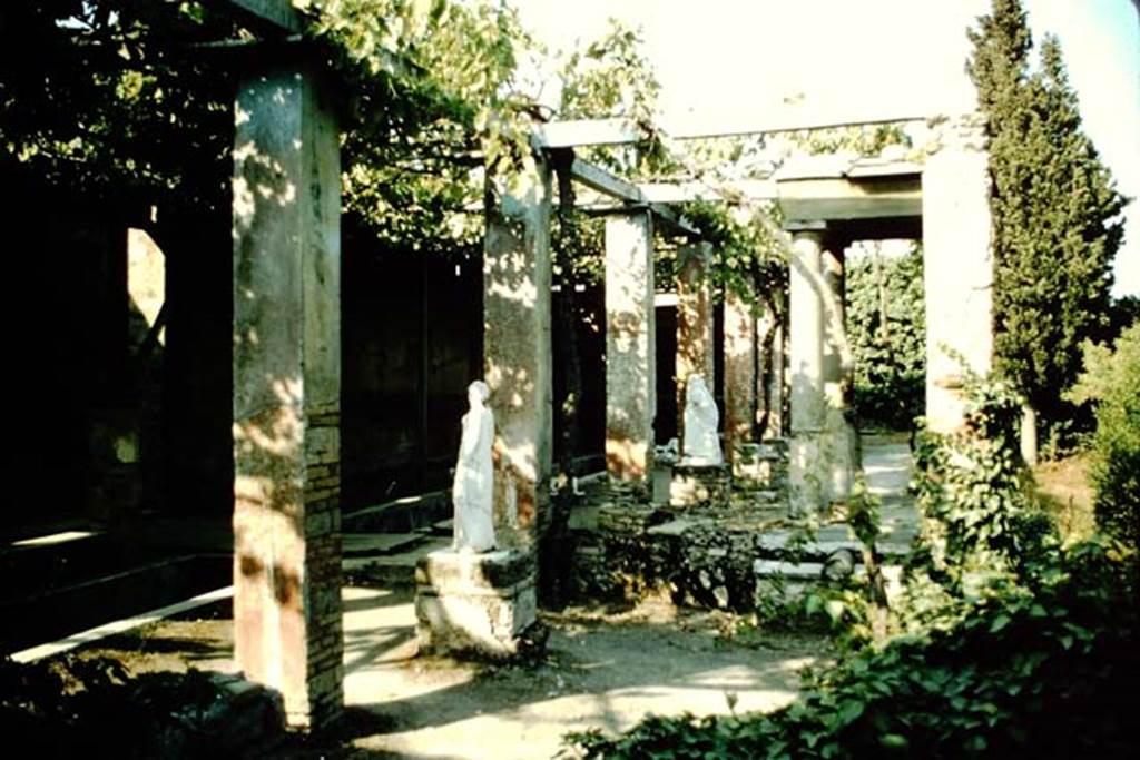 II.2.2 Pompeii. 1957. Room "i", looking east across upper garden area. Jashemski describes the two surviving statues as, one of Polyhymnia (SAP 2917) and the second of Mnemosyne (SAP 2909).
The names on her photographs however are reversed. 
See Jashemski, W. F., 1993. The Gardens of Pompeii, Volume II: Appendices. New York: Caratzas. (p. 80-1, Figs 84-85).
 Photo by Stanley A. Jashemski.
Source: The Wilhelmina and Stanley A. Jashemski archive in the University of Maryland Library, Special Collections (See collection page) and made available under the Creative Commons Attribution-Non Commercial License v.4. See Licence and use details.
J57f0472
