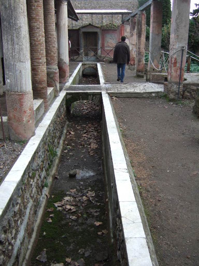 II.2.2 Pompeii. December 2005. Room “i”.  Looking east along upper euripus water feature.