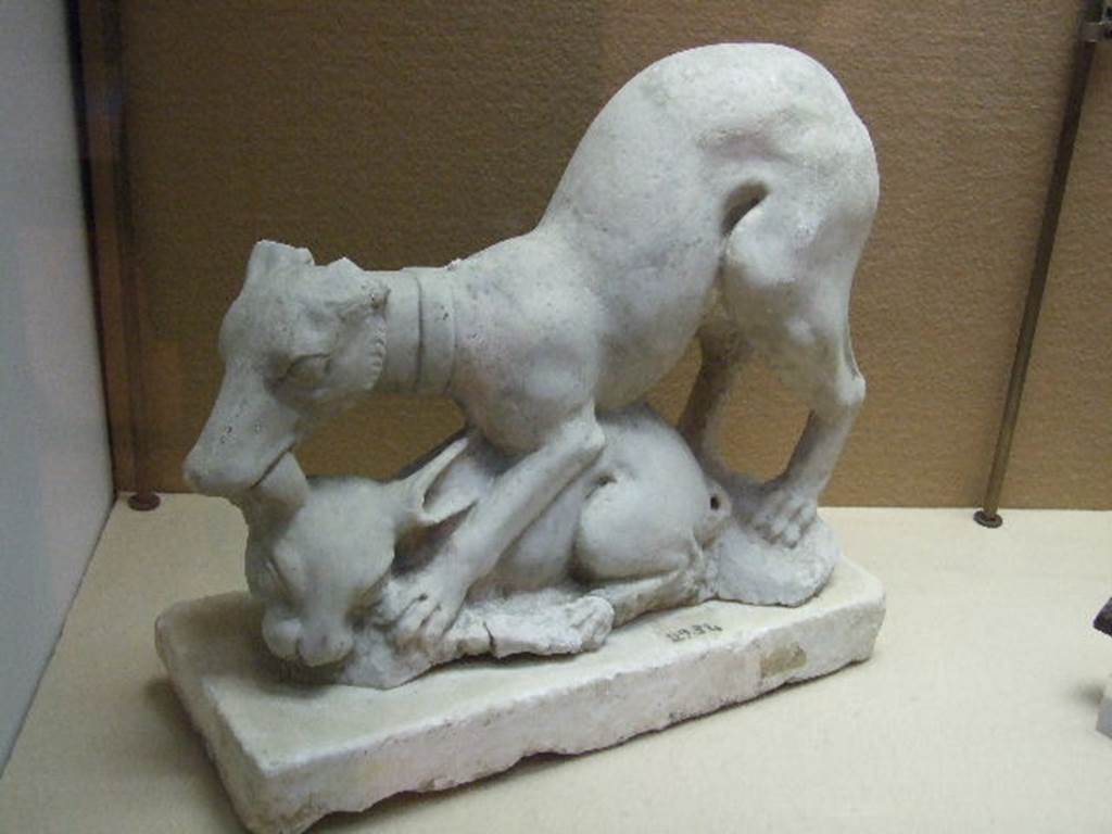 II.2.2 Pompeii. Room “i”. Marble group of dog and faun. Found on the south side of the upper euripus in the garden in 1920. SAP inventory number 2934. Now in Boscoreale Antiquarium.
