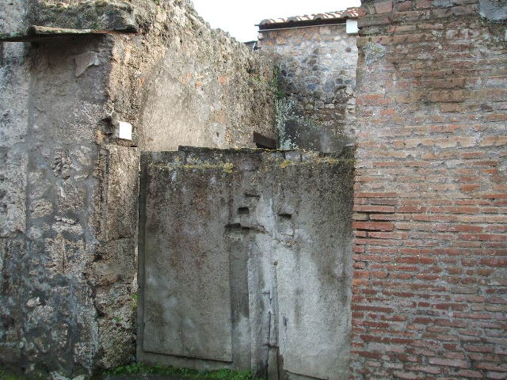 II.3.2 Pompeii.  December 2004. Entrance, with plaster cast of original doors.
