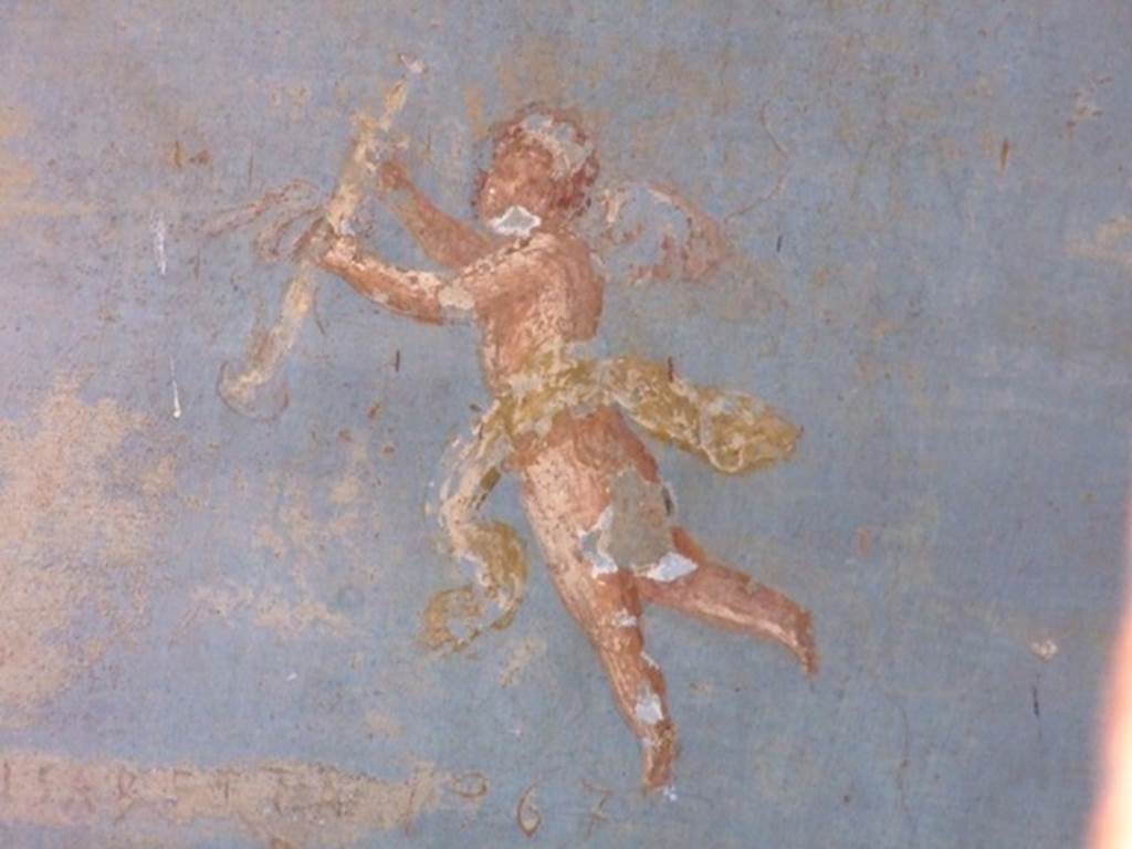 II.3.3 Pompeii.  March 2009. Room 10, West wall. Painting of flying cherub.