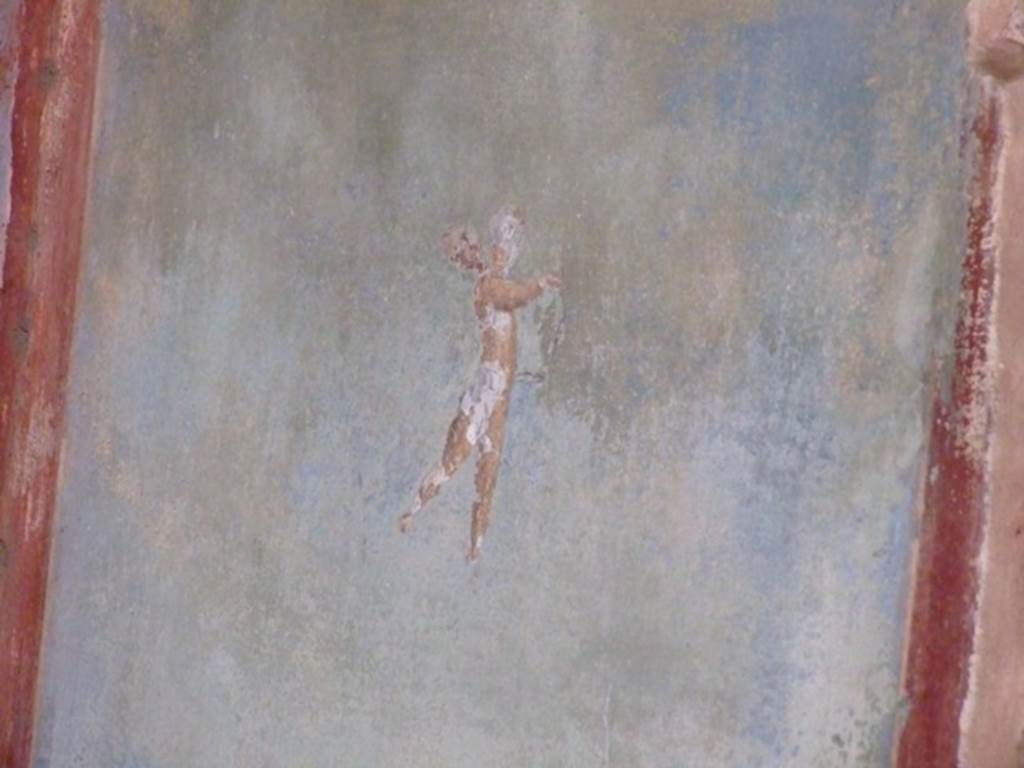 II.3.3 Pompeii.  March 2009. Room 10, West wall. Painting of flying cherub.