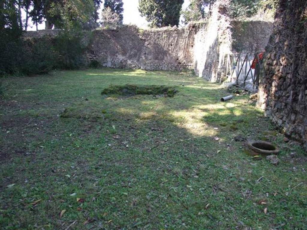 II.3.7 Pompeii.  March 2009.  Garden area, looking west.  Remains of masonry triclinium.