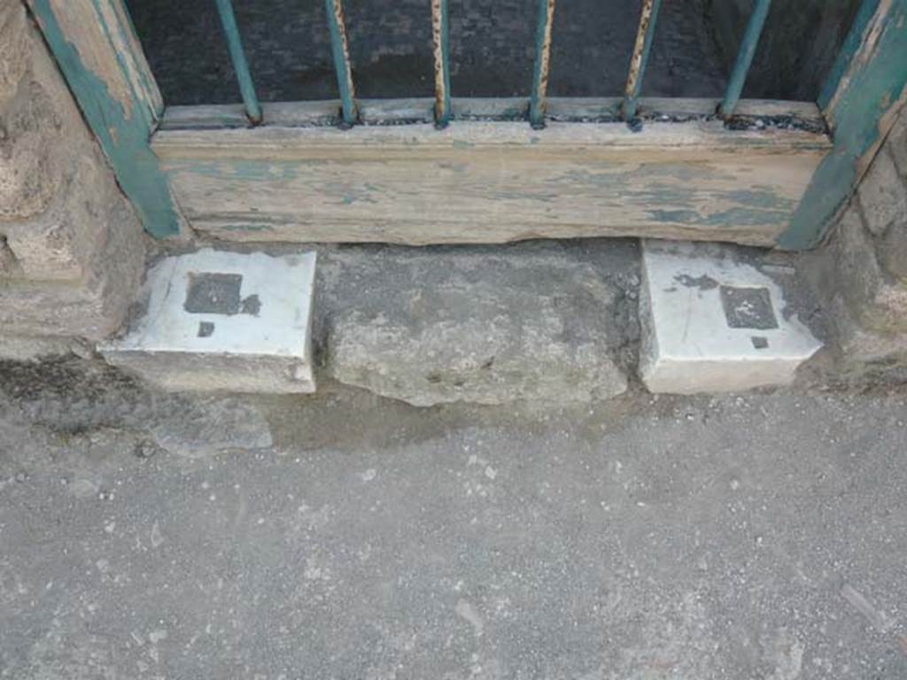 II.4.2 Pompeii. May 2012. Detail from entrance doorway threshold. Photo courtesy of Buzz Ferebee.

