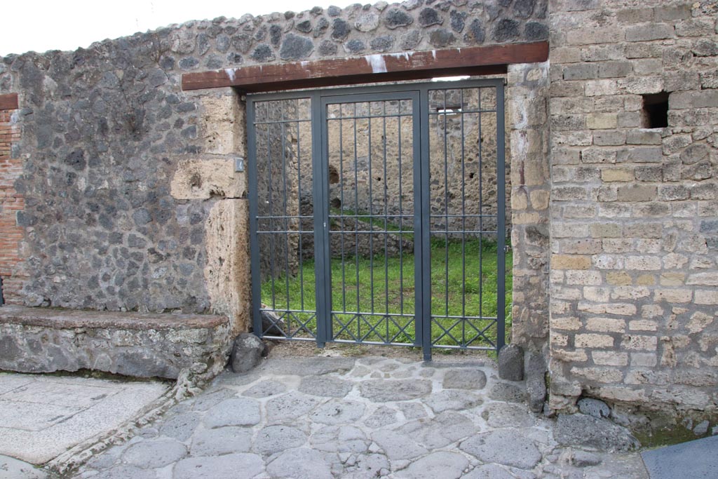 II.4.4 Pompeii, on right. December 2018. Looking south to entrance doorway, with II.4.5 on left. Photo courtesy of Aude Durand.