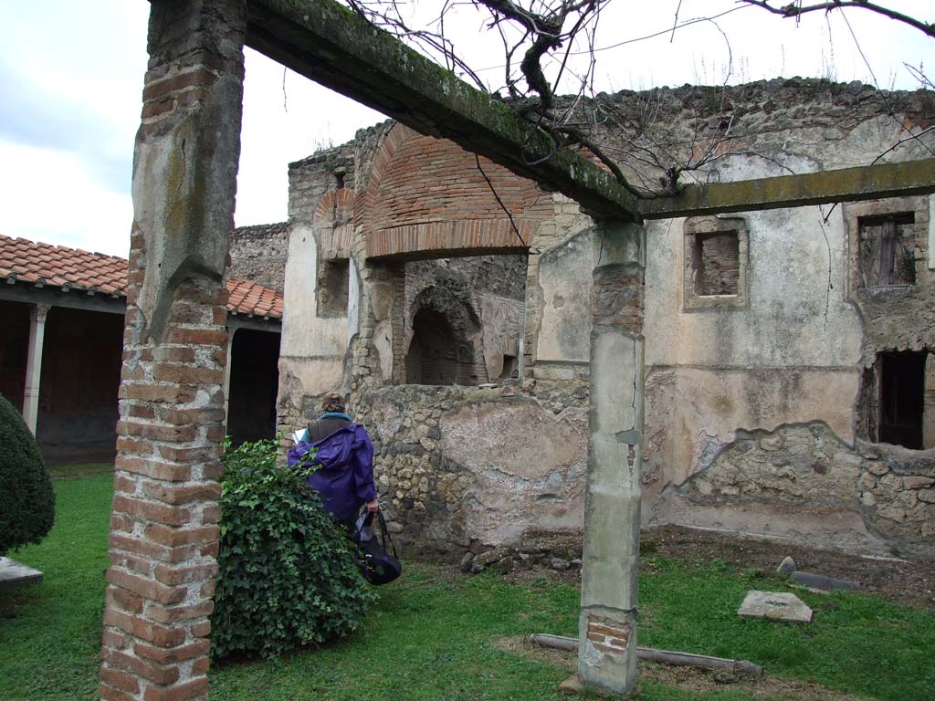 II.4.6 Pompeii. December 2006. Window to caldarium from pergola in garden, looking north-west.