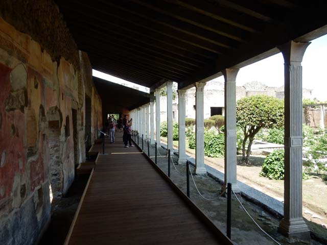 II.4.6 Pompeii. September 2019. Looking towards painted west wall of portico, at its southern end.
The doorway of the room, pictured below, is on the right. Photo courtesy of Klaus Heese.
