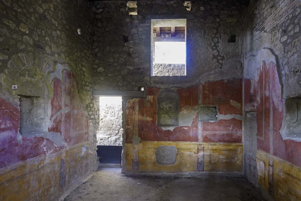 II.4.6 Pompeii. September 2019. 
Looking towards south wall, and doorway to rear corridor in south-west corner, in room at south end of west portico. 
Photo courtesy of Klaus Heese.
