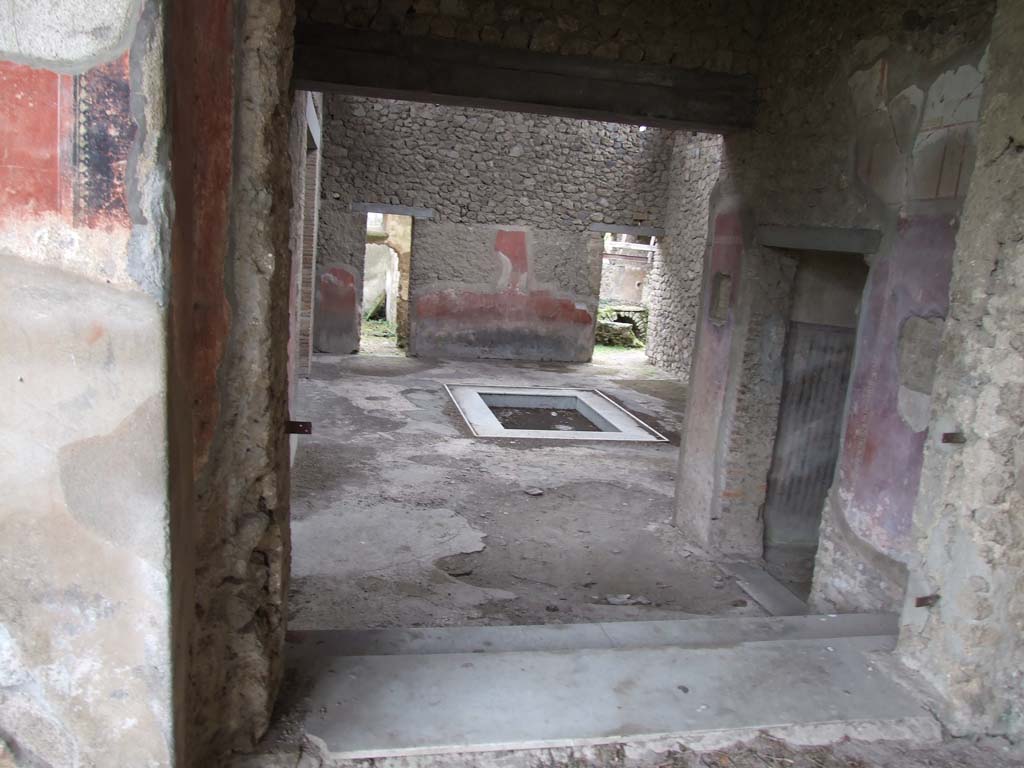 II.4.6 Pompeii. December 2006.  Corridor to rear of Nymphaeum, with blocked door in outside wall
