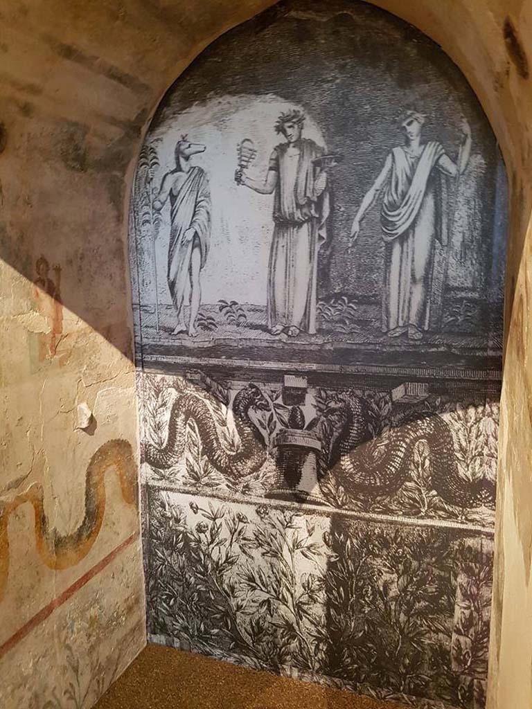 II.4.6 Pompeii. June 2016. Reconstruction of niche from sacrarium, looking towards rear.
According to Boyce’s description, Piranesi's print (here shown on the rear wall) is inaccurate in that Isis should be seated upon a throne but is standing in the centre.
See Boyce G. K., 1937. Corpus of the Lararia of Pompeii. Rome: MAAR 14.  (p.95, no.471)

Photograph © Parco Archeologico di Pompei.


